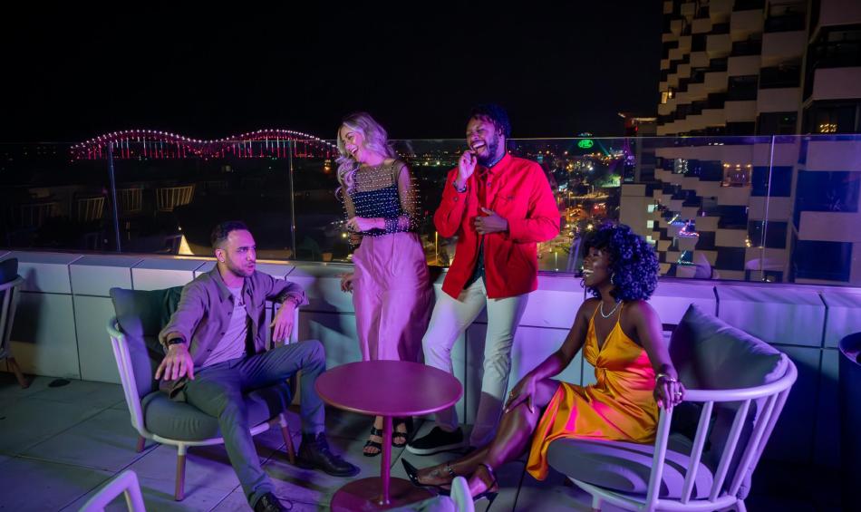 Friends at the rooftop bar Beck and Call at Hyatt Beale Street Memphis.