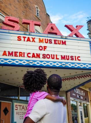 Dad and daughter standing outside Stax Museum of American Soul Music