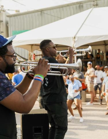 Taste The Rarity band playing at the event with people dancing