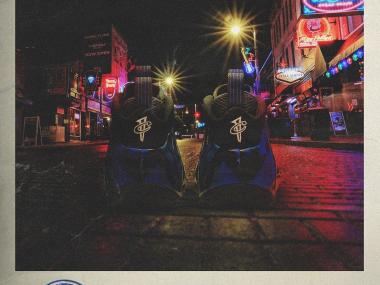 PIcutre of two Shoes on the street with the words "ballin on Beale" acorss the bottom