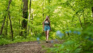 A woman hiking the trails at Meeman Shelby Forest State Park.