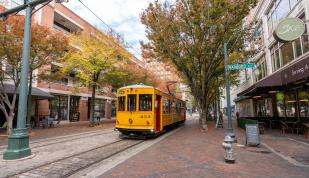 trolley drives down Main Street during the fall