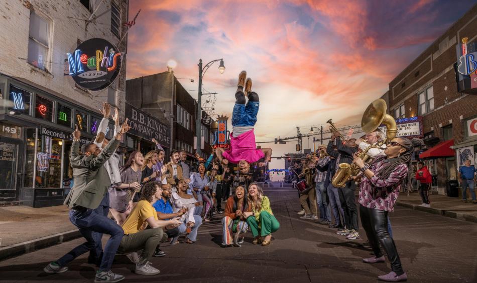 people lined up on beale street with beale street flippers jumping over their heads