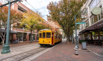 trolley drives down Main Street during the fall