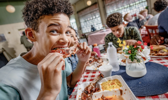 boy eats rib at payne's